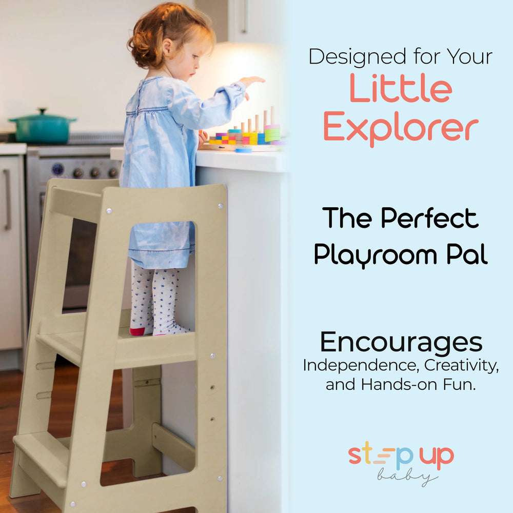 adjustable toddler tower positioned in kitchen for easy play