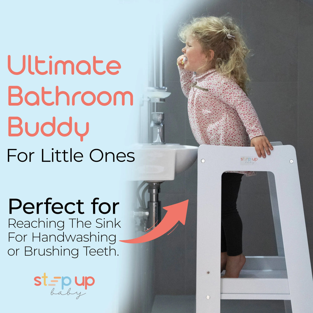 white toddler tower positioned at bathroom sink for easier reach